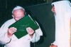 Hmm, why is he kissing the koran